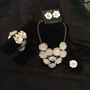 Necklace. Earrings, bracelet, and ring